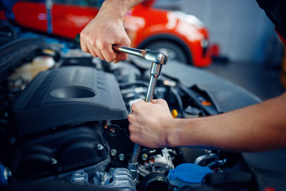 Worker Disassembles Vehicle Engine, Car Service